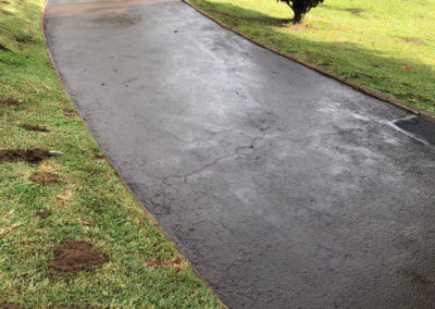 Newly constructed concrete driveaway paving in a garden
