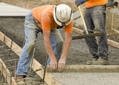 Two workers are working to construct a concrete sidewalk,Los Angeles
